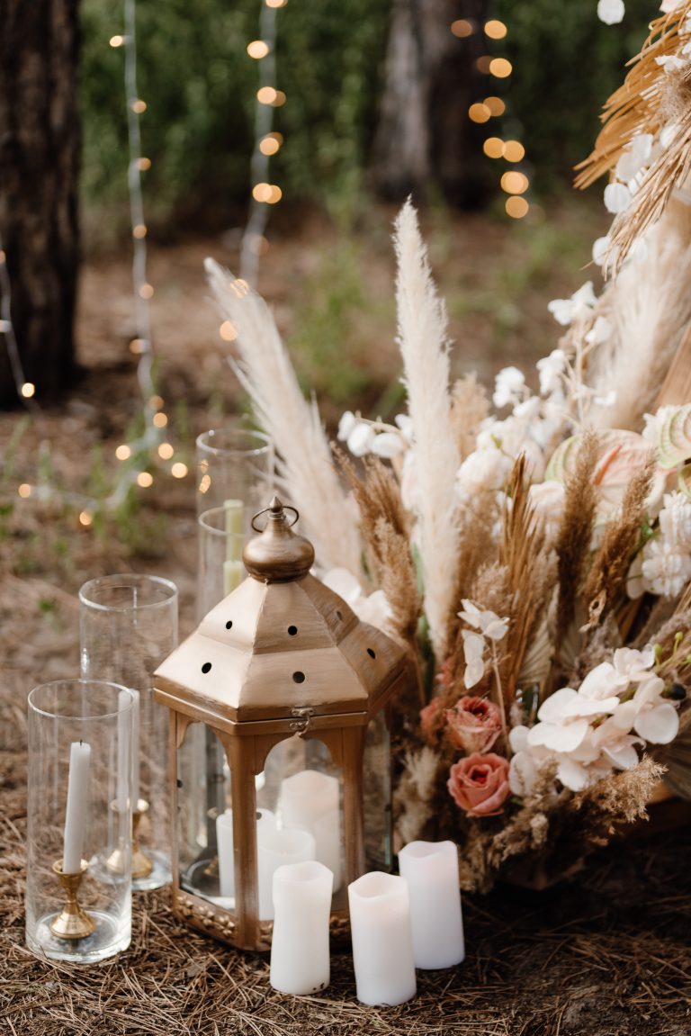 wedding ceremony area with dried flowers in a meadow in a pine brown forest
